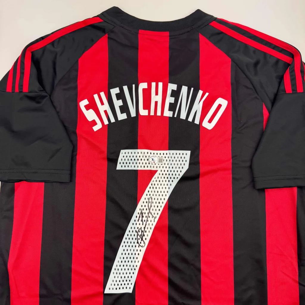 Back side of autographed andriy shevchenko ac milan red and black soccer jersey with perforated design and white nameplate