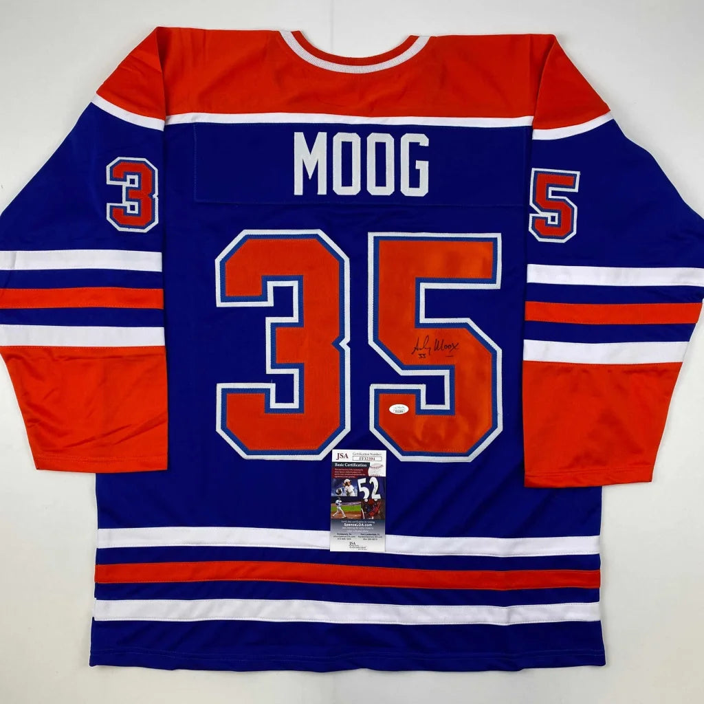 Autographed Andy Moog Edmonton Oilers custom jersey, blue and orange with white trim, name Moog and number 35 in red