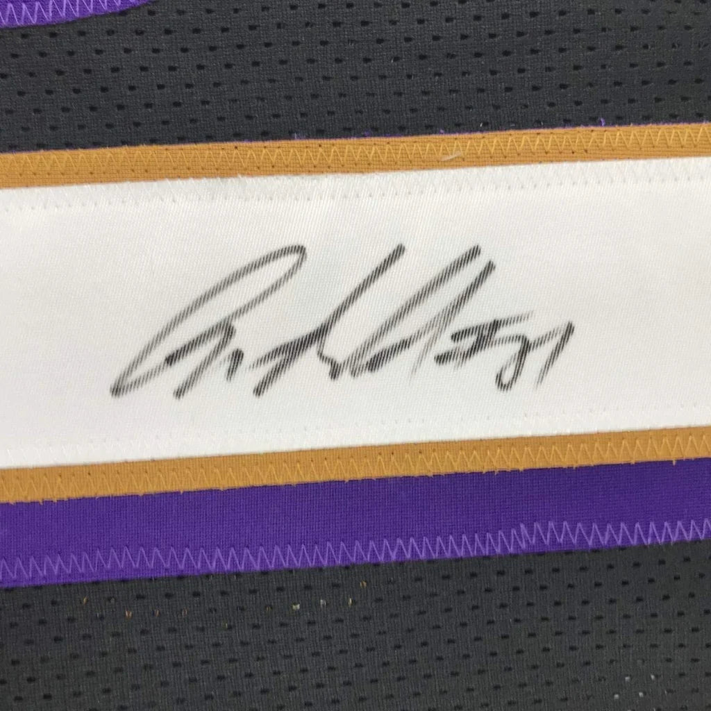 White signature label with black ink and gold purple trim on autographed anquan boldin baltimore custom jersey for professional sports league