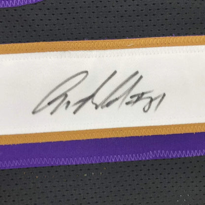 White signature label with black ink and gold purple trim on autographed anquan boldin baltimore custom jersey for professional sports league
