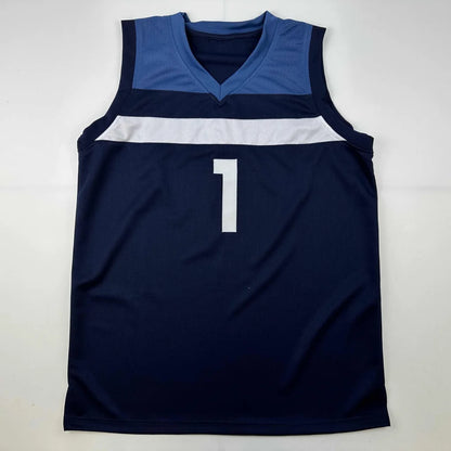 Navy blue sleeveless custom jersey with white stripe and number 1 signed by Anthony Edwards from professional sports league