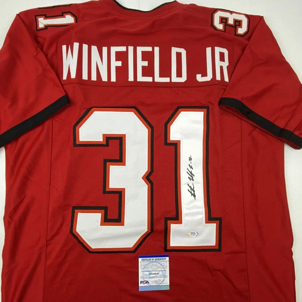 Back side of red autographed Antoine Winfield Jr Tampa Bay custom jersey with white and black trim from professional sports league