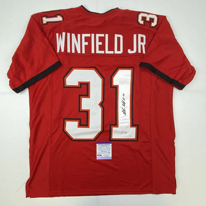 Red custom football jersey with white black trim featuring winfield jr 31 from professional sports league signed