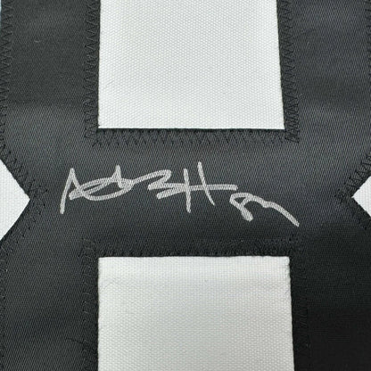 Autographed Antonio Brown Pittsburgh Bumble Bee custom jersey with silver stitched signature on black and white checkered fabric