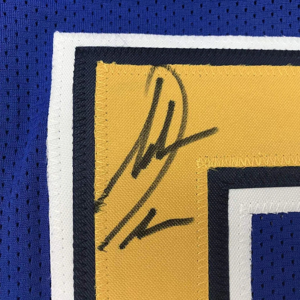 Autographed yellow custom jersey with blue and white trim from professional sports league