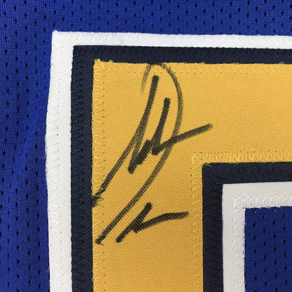 Autographed yellow custom jersey with blue and white trim from professional sports league