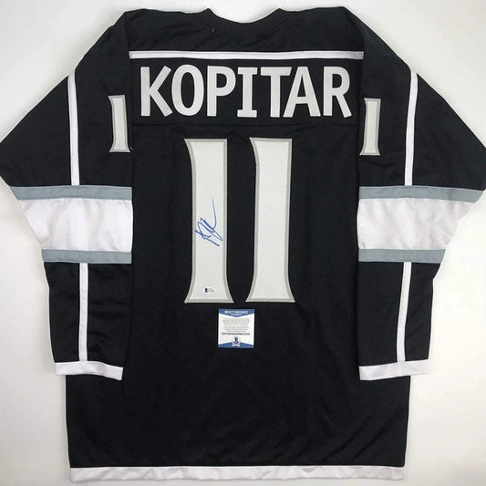 Black hockey jersey with white gray accents, signed Anze Kopitar memorabilia