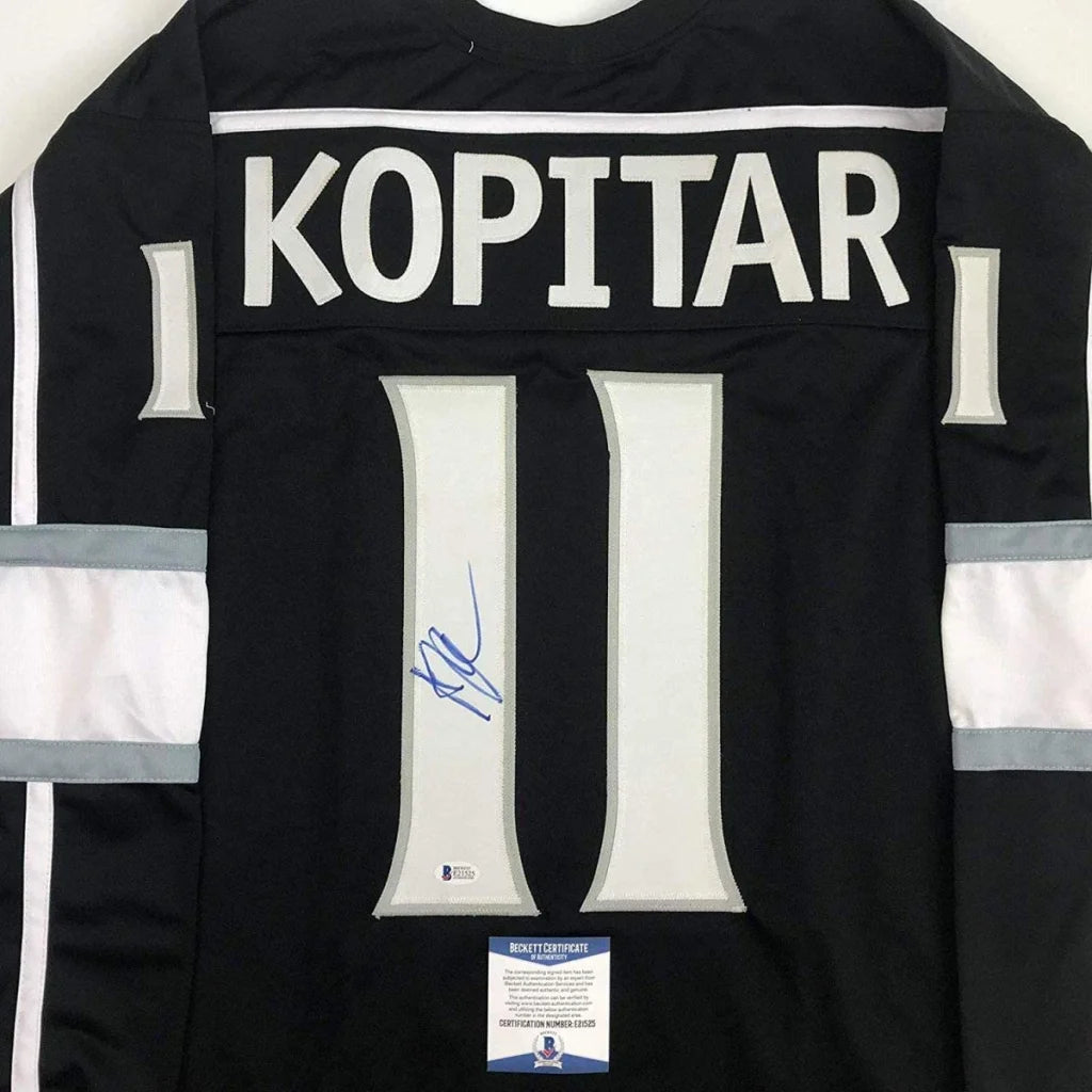Black hockey custom jersey of Anze Kopitar with signed blue ink memorabilia