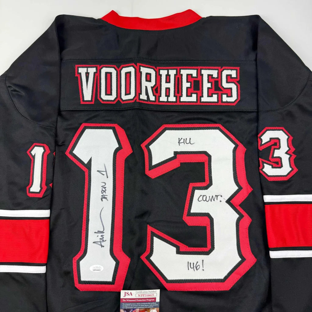 Back of autographed Ari Lehman Jason Voorhees Friday the 13th black hockey jersey with red and white trim and number 13