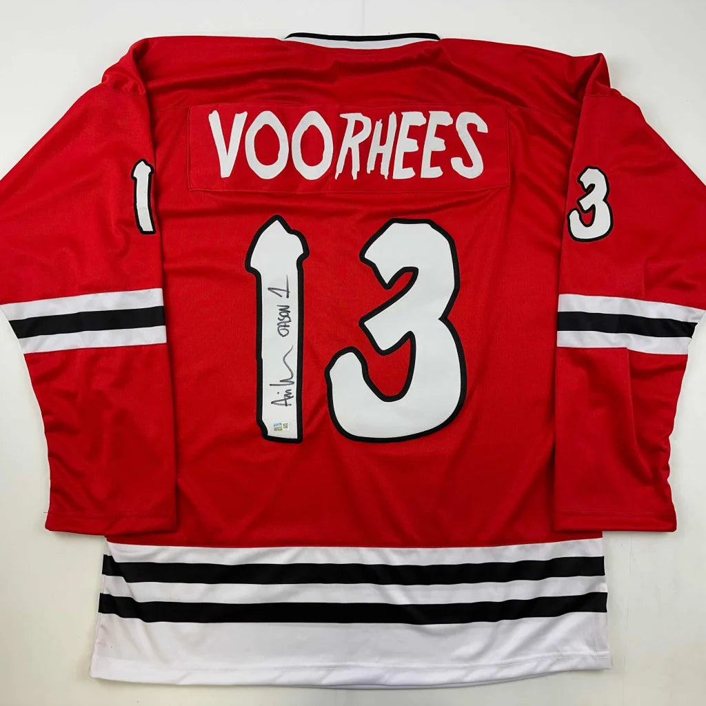 Red hockey jersey with black and white stripes, number 13, autograph, third party authentication