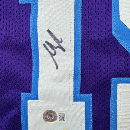 Purple and white custom sports jersey signed by Reaves, perfect for sports league fans