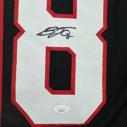 Black custom jersey with white and red numbers, signed, authentic, for professional sports fans