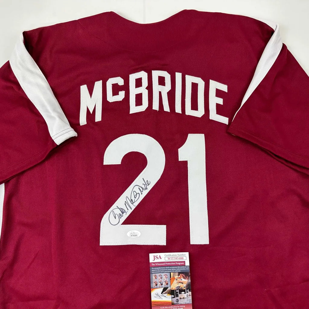 Autographed maroon and white custom jersey with McBride 21 for sports league fans