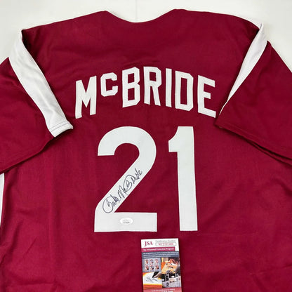 Autographed maroon and white custom jersey with McBride 21 for sports league fans