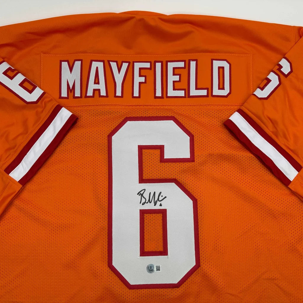 Back view of autographed baker mayfield orange creamsicle retro throwback football custom jersey with white maroon lettering