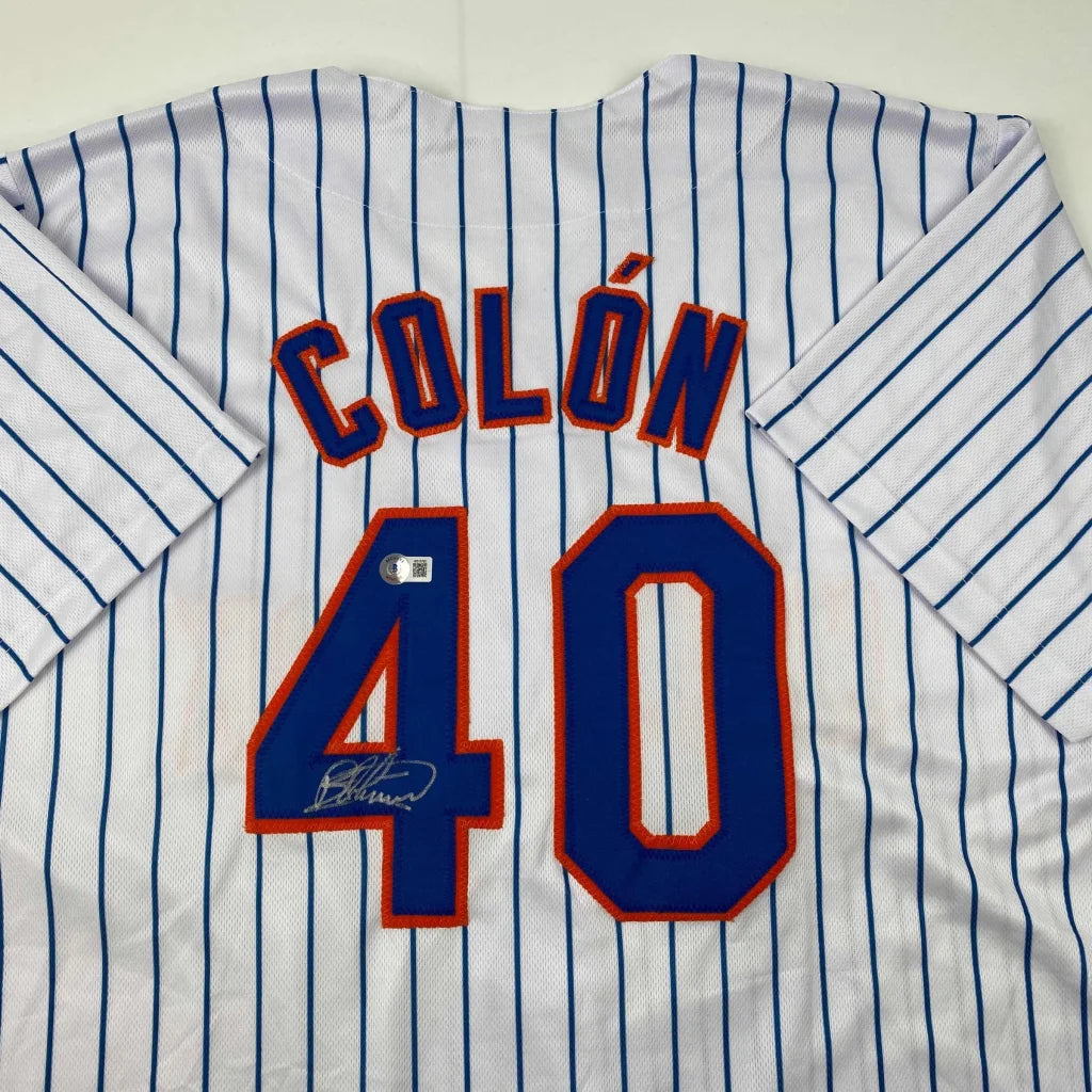 White pinstriped custom jersey with blue and orange lettering from a pro sports league