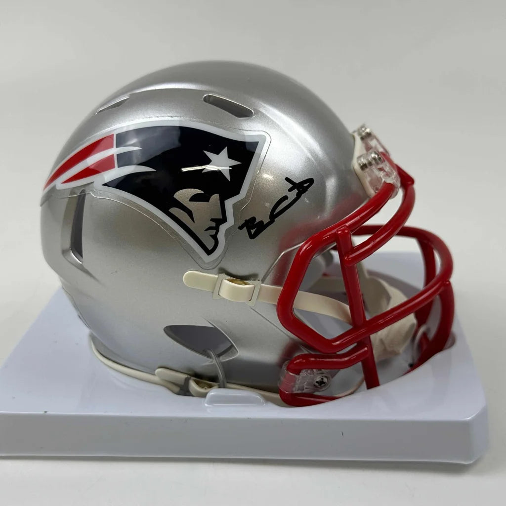 Silver New England Patriots mini football helmet with red facemask and third party authentication