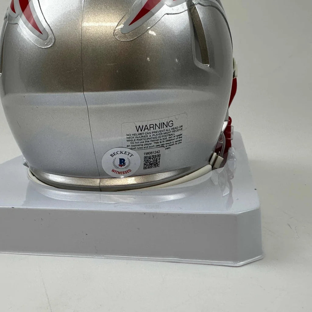 Silver New England Patriots mini helmet with red and white stripes and third party authentication