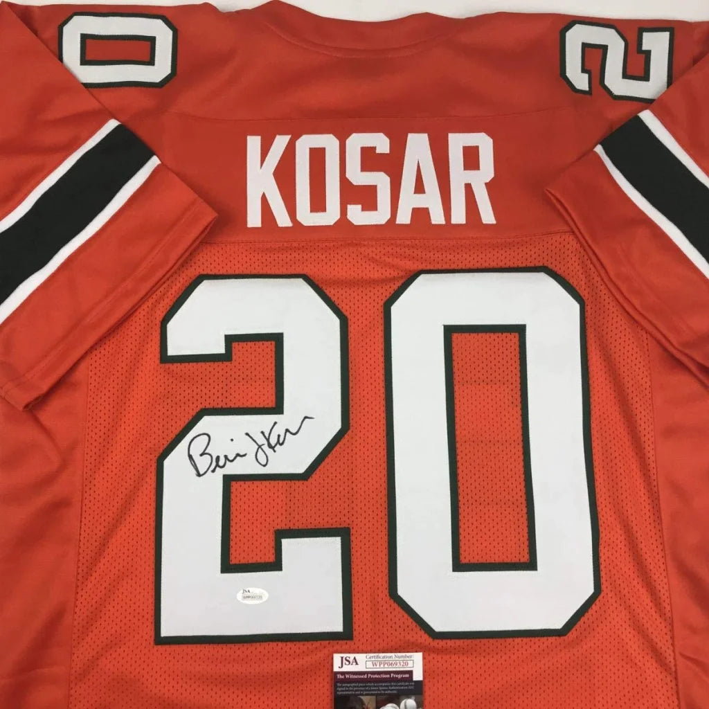 Red custom football jersey signed by Bernie Kosar featuring white and black lettering with number 20 from professional sports league