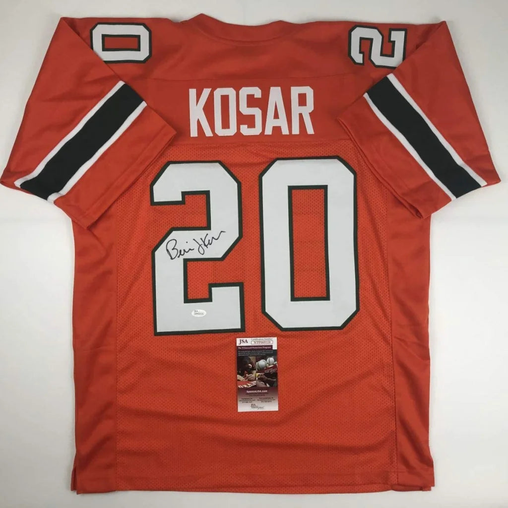 Back of custom orange miami football jersey with white black trim signed by bernie kosar number 20 professional sports league
