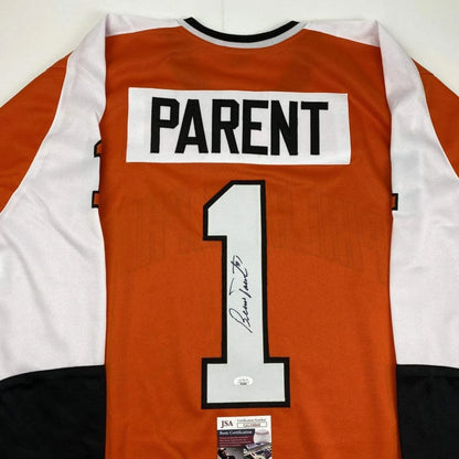 Autographed Bernie Parent Philadelphia Orange Hockey Jersey JSA COA | Certified Authentic Signed Memorabilia | vintageantiquesgifts.com