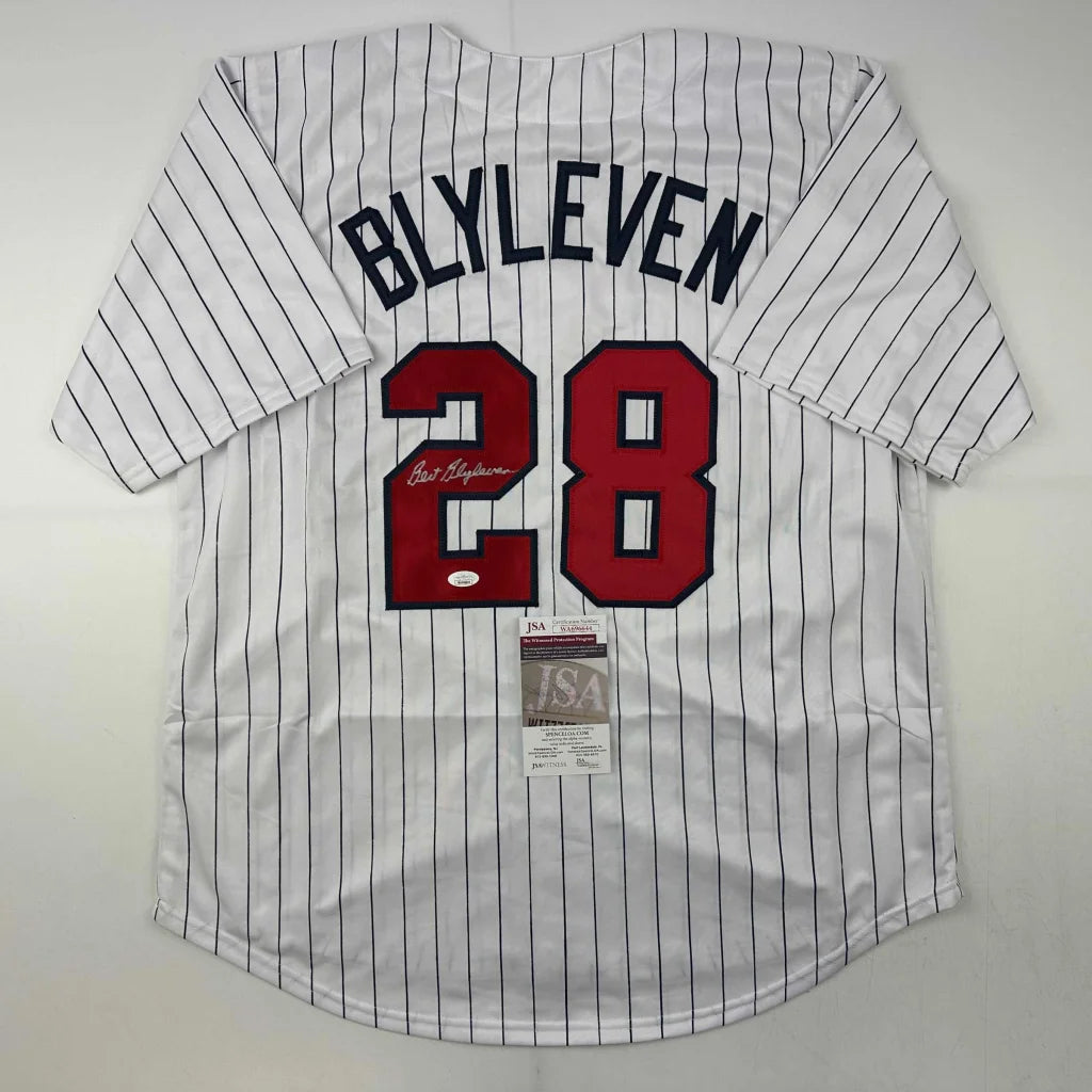 White pinstriped baseball jersey with red 28 and signed black nameplate, perfect custom sports league collectible