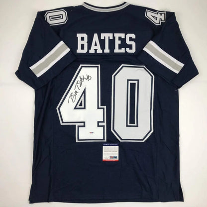 Back of a navy blue bill bates dallas cowboys custom jersey with white and silver lettering signed by brian c for professional sports league fans