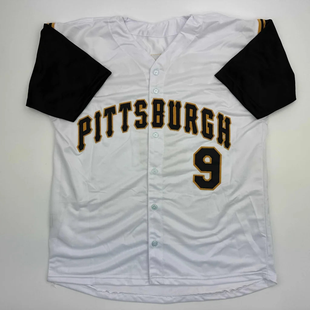 White custom jersey with black sleeves and gold black lettering for professional sports league