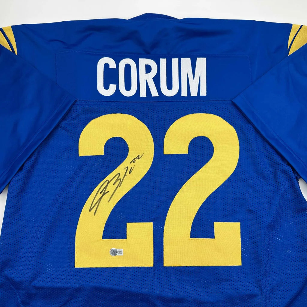 Blue custom jersey with yellow numbers and autograph, perfect for professional sports fans