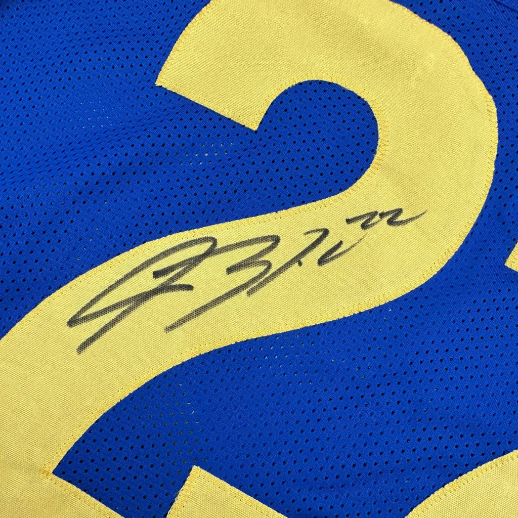 Blue custom jersey with yellow number and autograph from a professional sports league