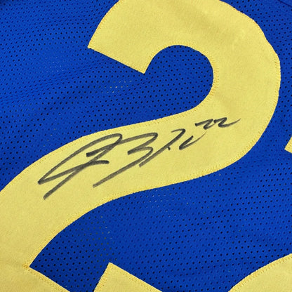 Blue custom jersey with yellow number and autograph from a professional sports league