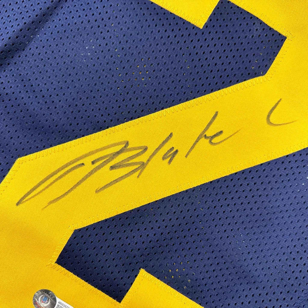 Autographed blue and yellow custom jersey from Blake Corum for professional sports fans