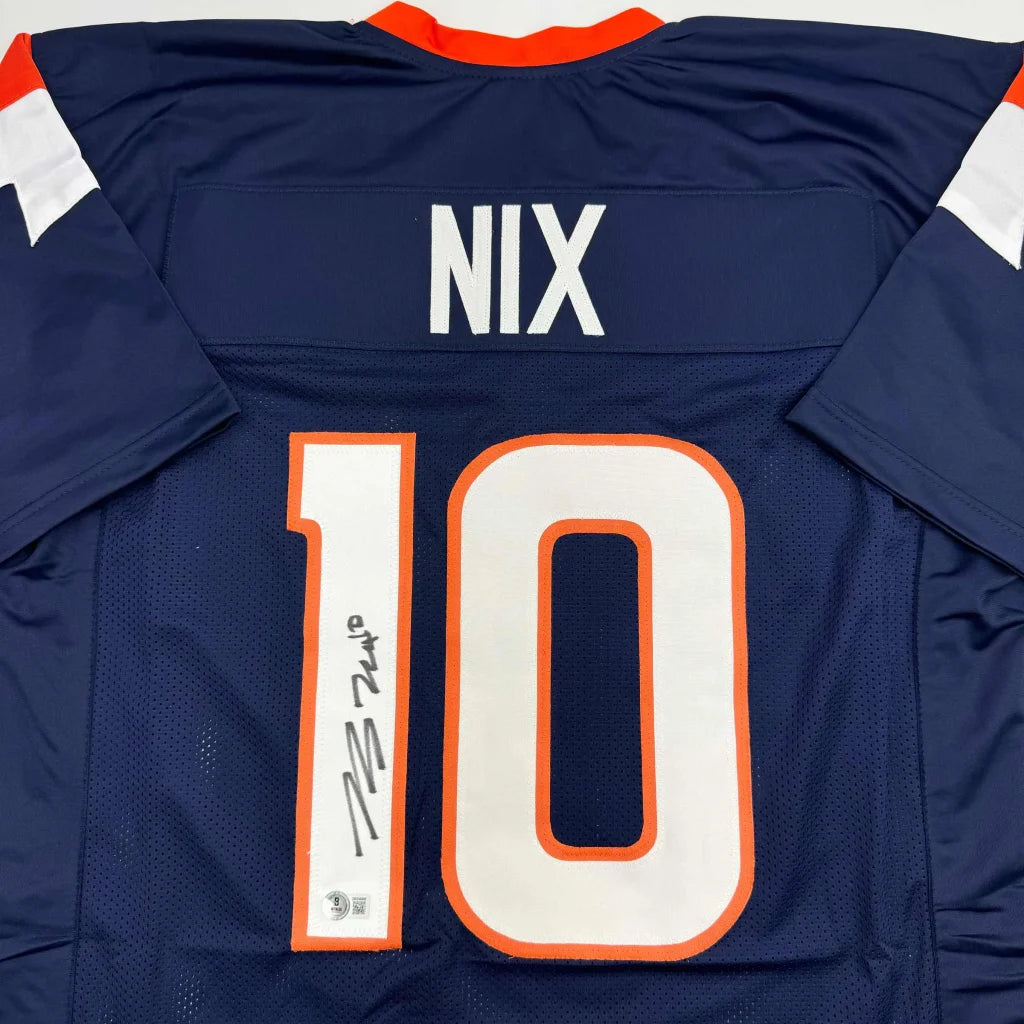 Back of navy blue autographed bo nix football jersey with orange white accents and custom professional sports league number 10