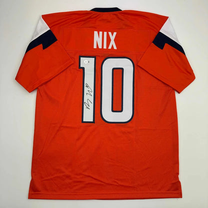 Orange custom jersey with NIX 10, autograph, for sports league fans, pro sports collectible