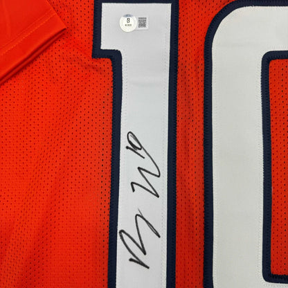 Orange custom jersey with number 10 signed by a professional sports athlete
