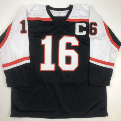 Black and white custom jersey with orange trim and number 16 for professional sports league