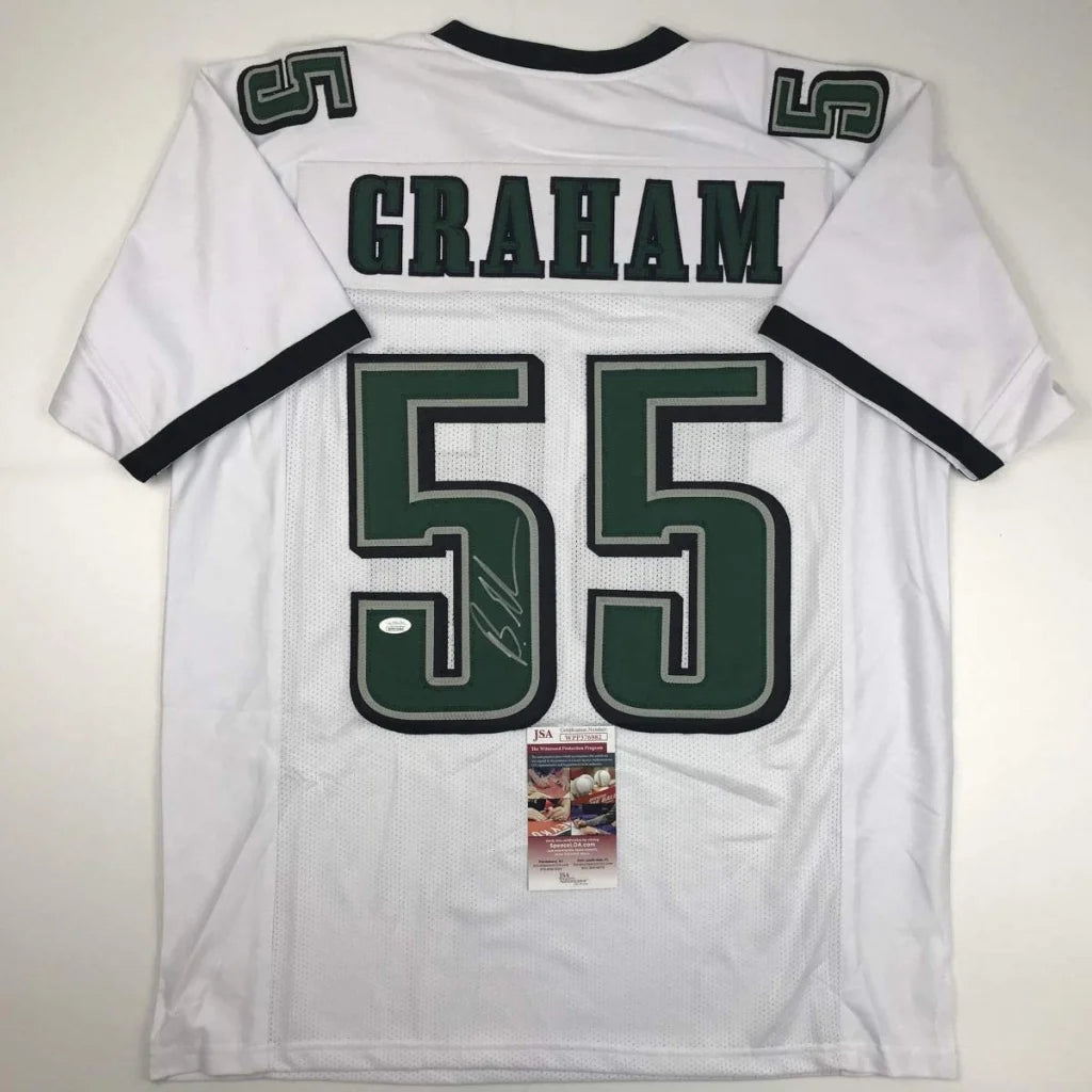 White and green custom football jersey with number 55 and signature from professional sports league