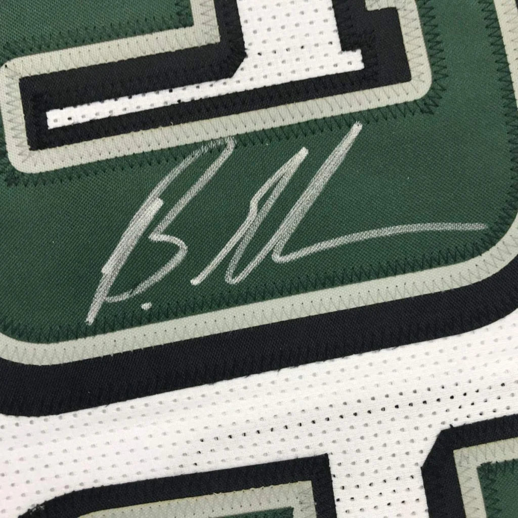 Autographed green and white custom jersey from a professional sports league era