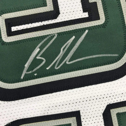Autographed green and white custom jersey from a professional sports league era