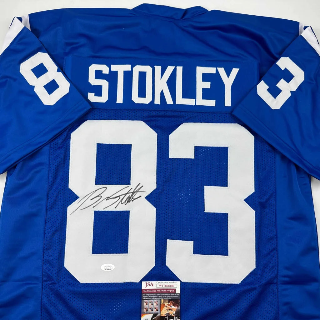 Autographed blue football jersey with STOKLEY 83 for professional sports fans and collectors
