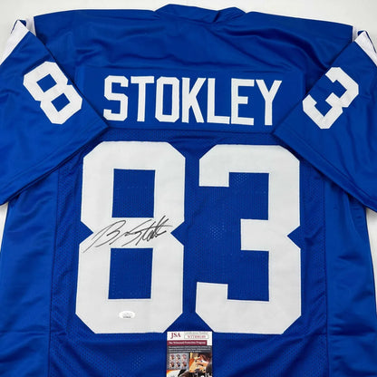 Autographed blue football jersey with STOKLEY 83 for professional sports fans and collectors