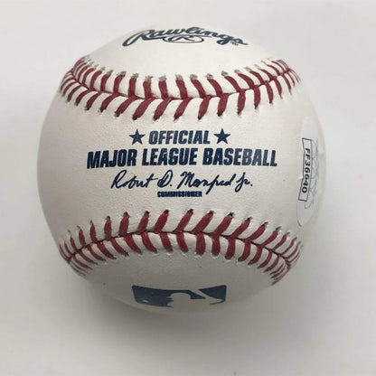 Authentic MLB autographed baseball with red stitching and official logos, JSA certified