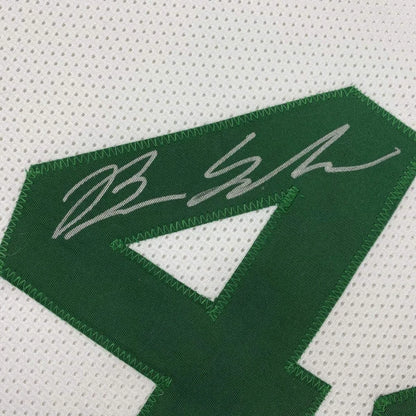 Green number patch with white signature stitched on perforated white fabric of autographed brian scalabrine custom jersey