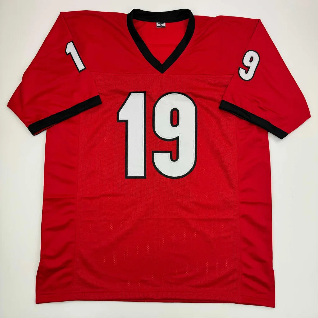 Autographed Brock Bowers Georgia red custom jersey with black trim and white numbers for professional sports league fans