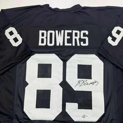 Autographed Brock Bowers Las Vegas Oakland Black Football Jersey Beckett BAS COA | Certified Authentic Signed Memorabilia | vintageantiquesgifts.com