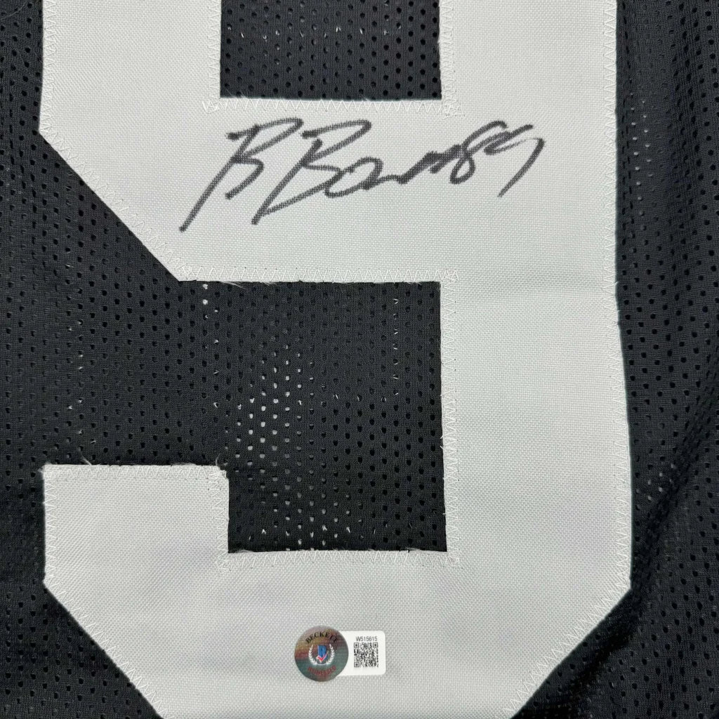 Black and white autographed custom jersey from a professional sports league collectible
