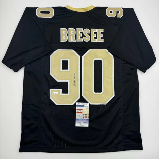 Autographed Bryan Bresee New Orleans Black Football Jersey JSA COA | Hall of Fame Sports Memorabilia | vintageantiquesgifts.com