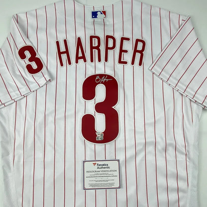 White Harper number 3 baseball jersey with red pinstripes and autograph on the back
