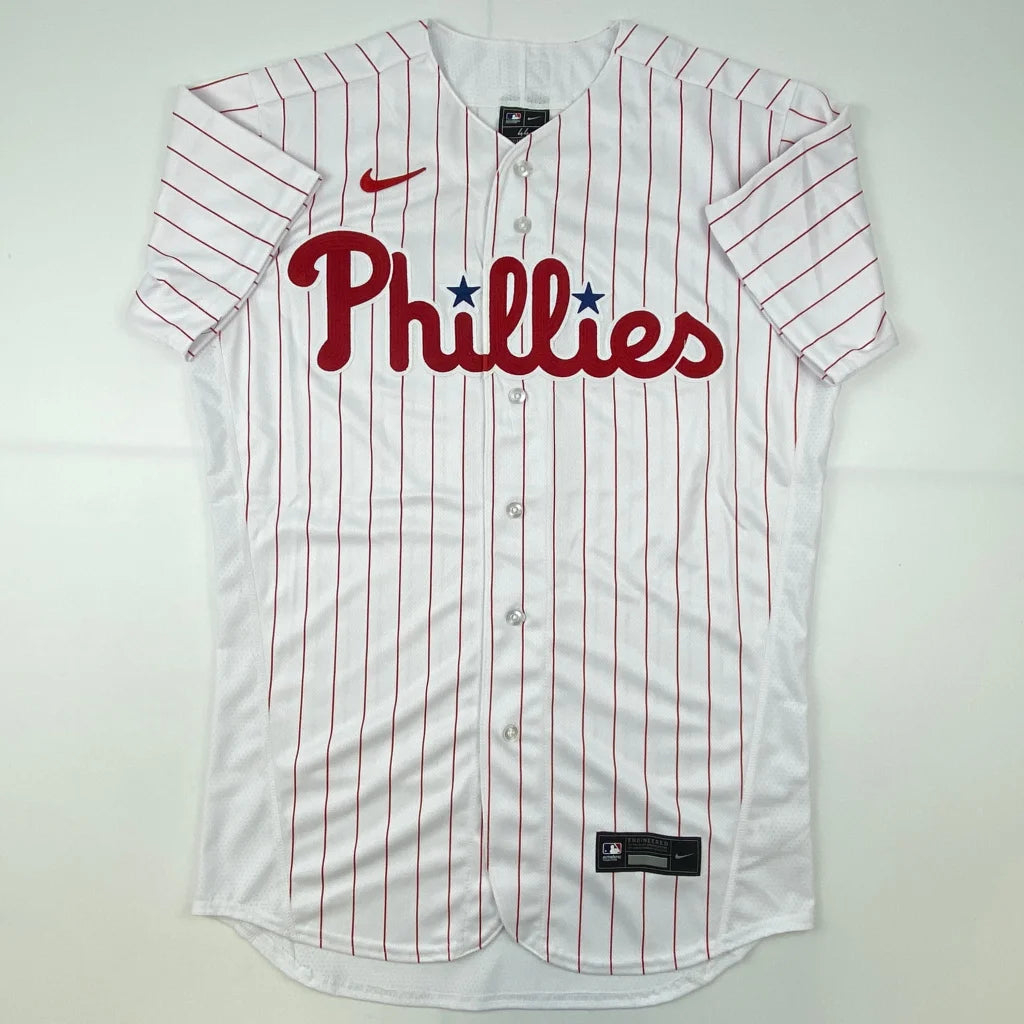 White Phillies baseball jersey with red pinstripes and red script logo