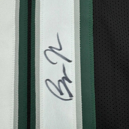 Autographed white green black striped fabric from a professional sports league jersey
